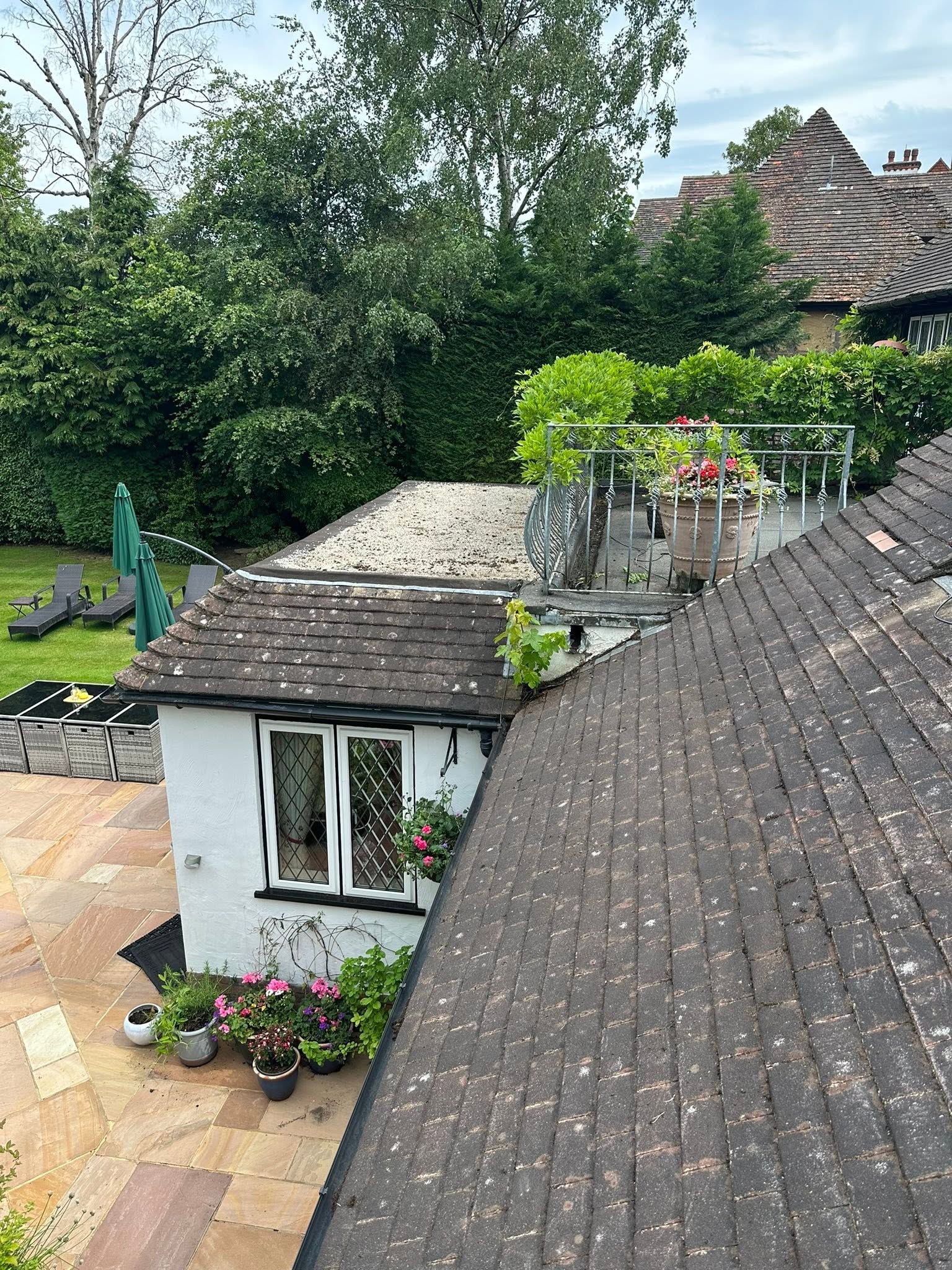 Diamond Roofing team at work on a tiled roof